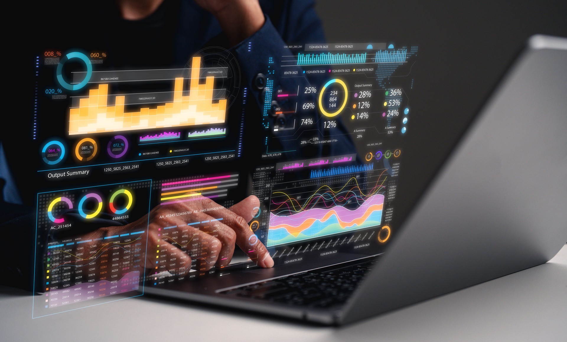 A person interacts with a laptop displaying vibrant data visualizations and graphs, illustrating detailed analytics and performance metrics.